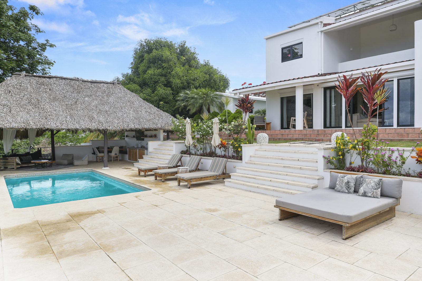 Pool, loungers and the main house